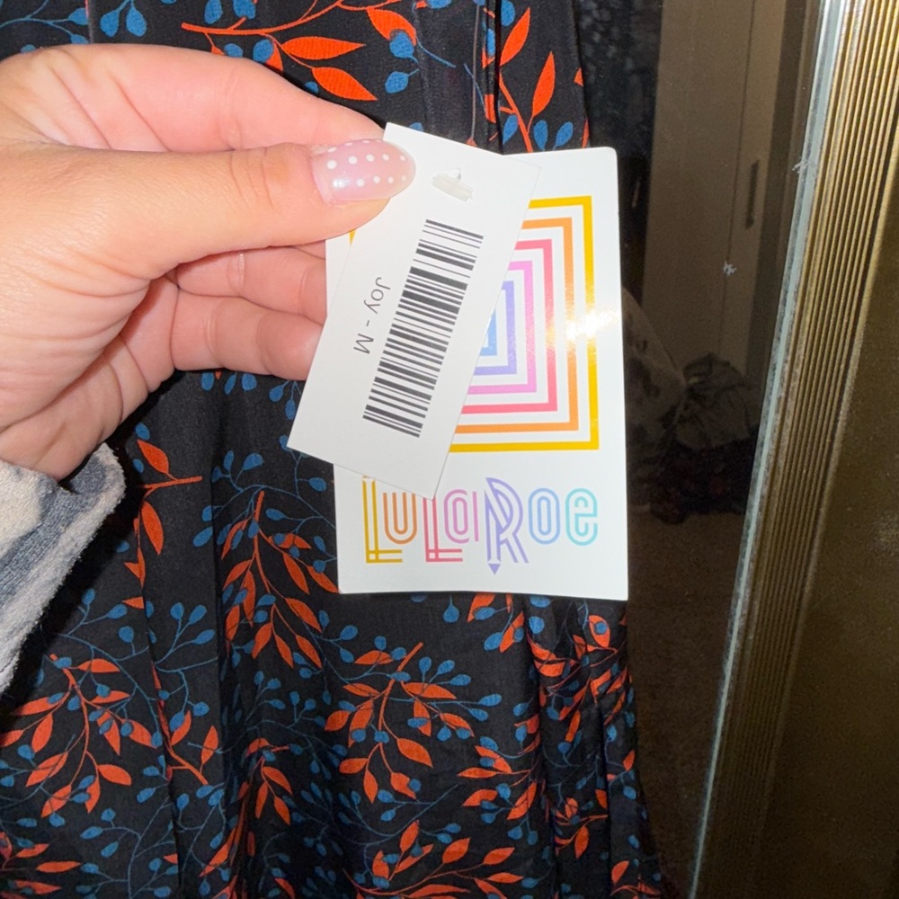 LuLaRoe Black and Red Floral Sleeveless Joy Vest - Picture 2 of 4